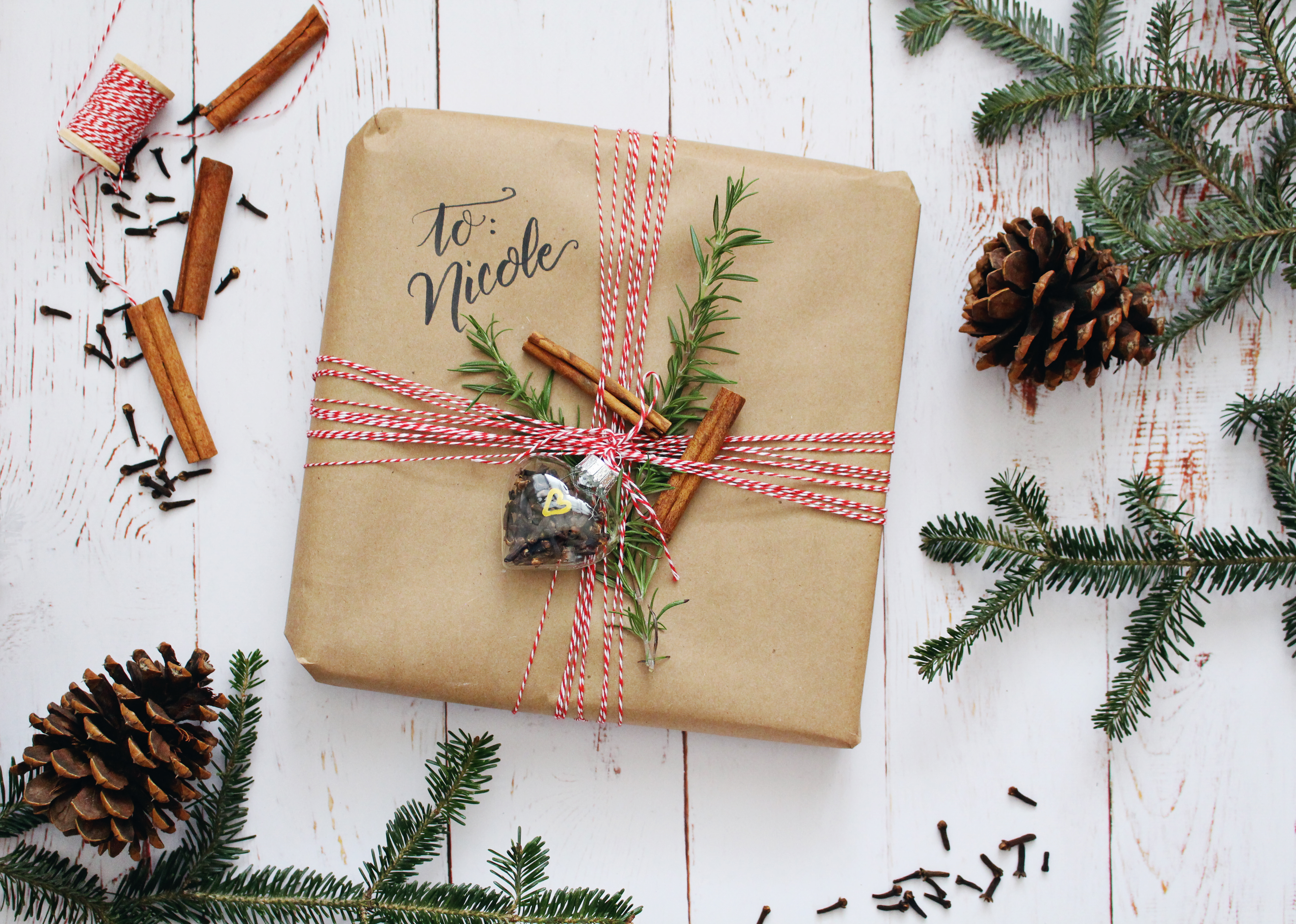 Kitchen theme wrapping idea: use kraft paper, baker's twine, herbs, and spices!