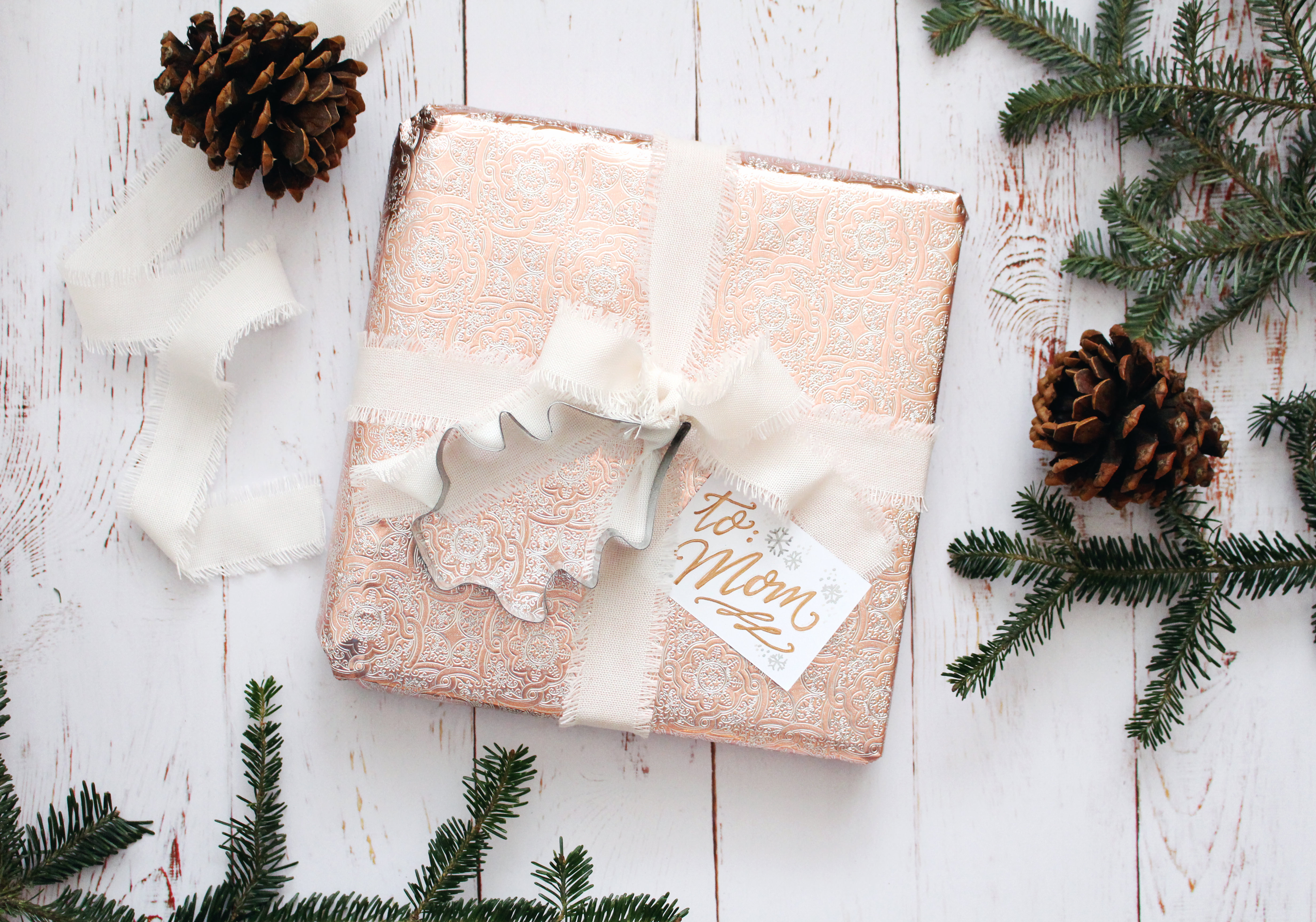 Use a Christmas cookie cutter as a cute gift wrap embellishment