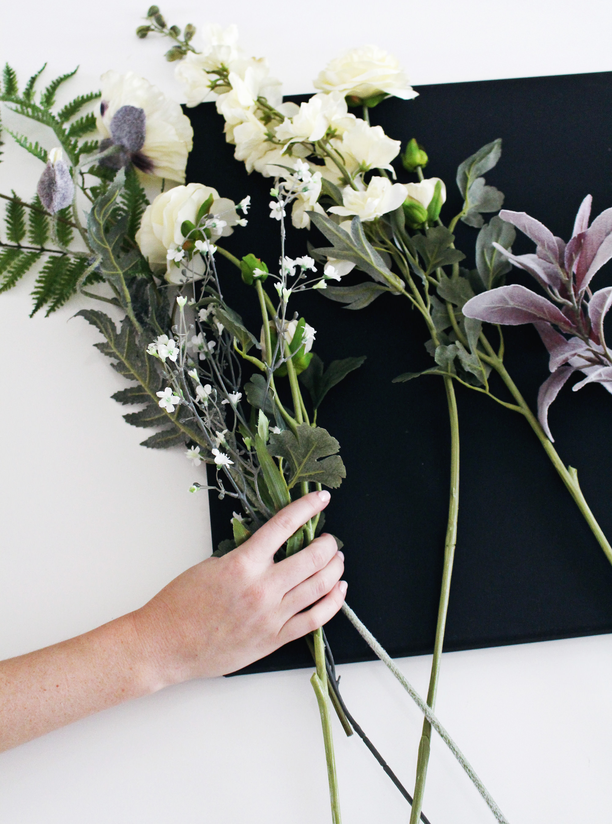 Choose faux flowers to create 3-D flower canvas wall art