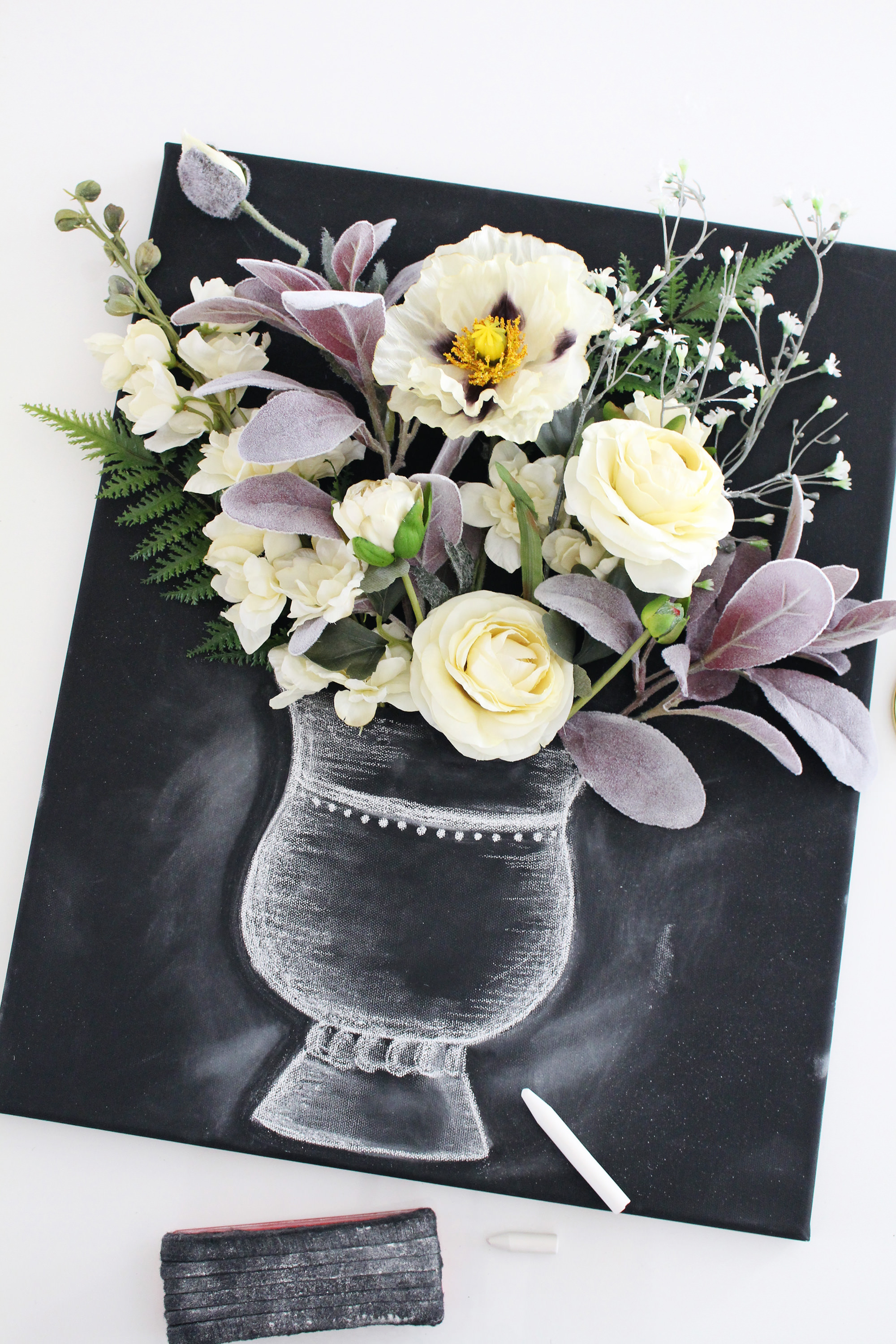 Combine flowers with chalk art to create this stunning 3-D flower canvas wall art on Lily & Val Living.