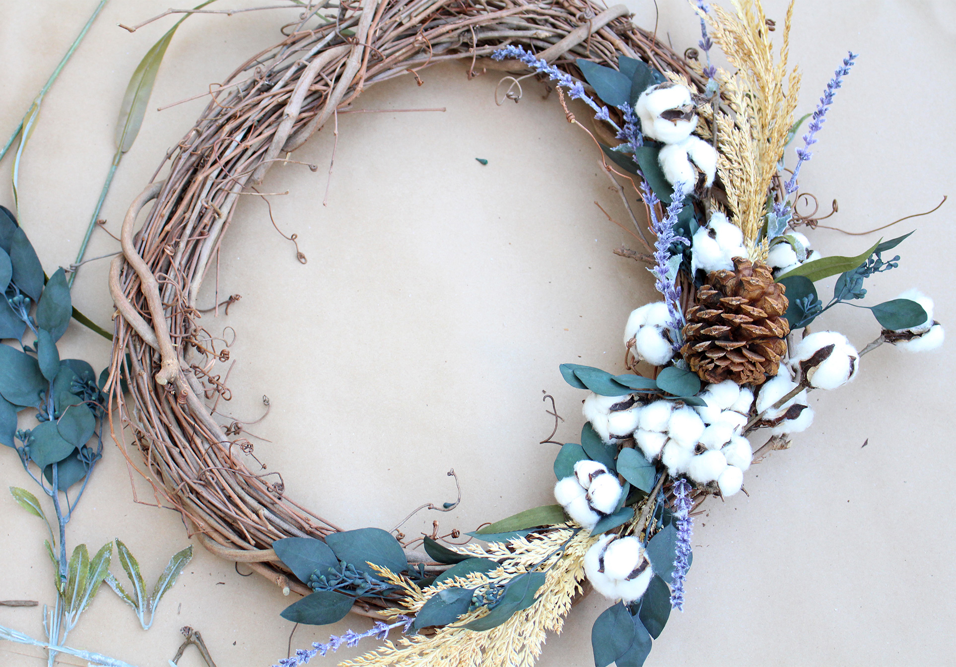 Use raw cotton, lavender, eucalyptus and pinecones to make a pretty DIY fall wreath