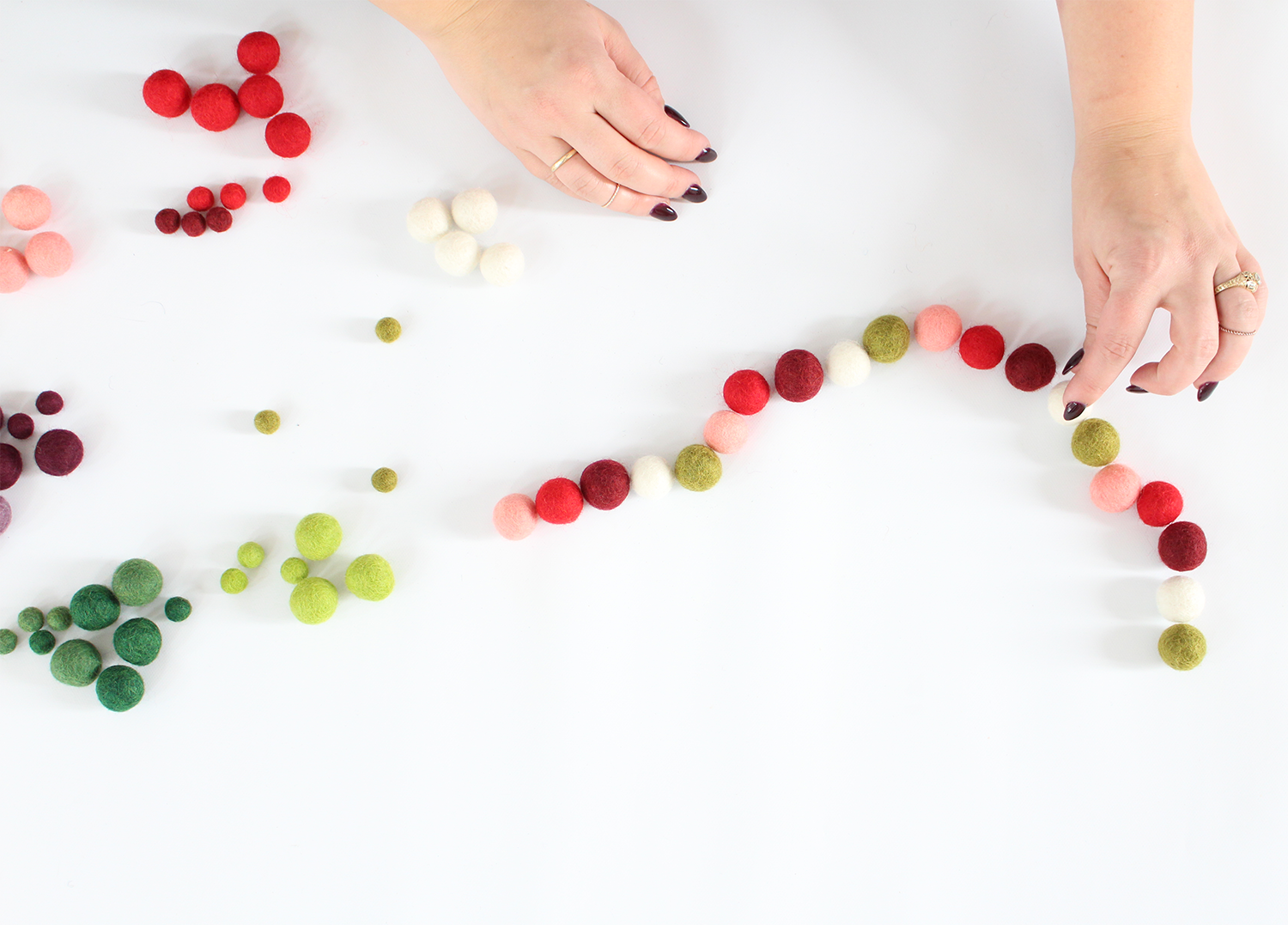 Felt Balls make an adorable holiday garland. Get the DIY on Lily & Val Living