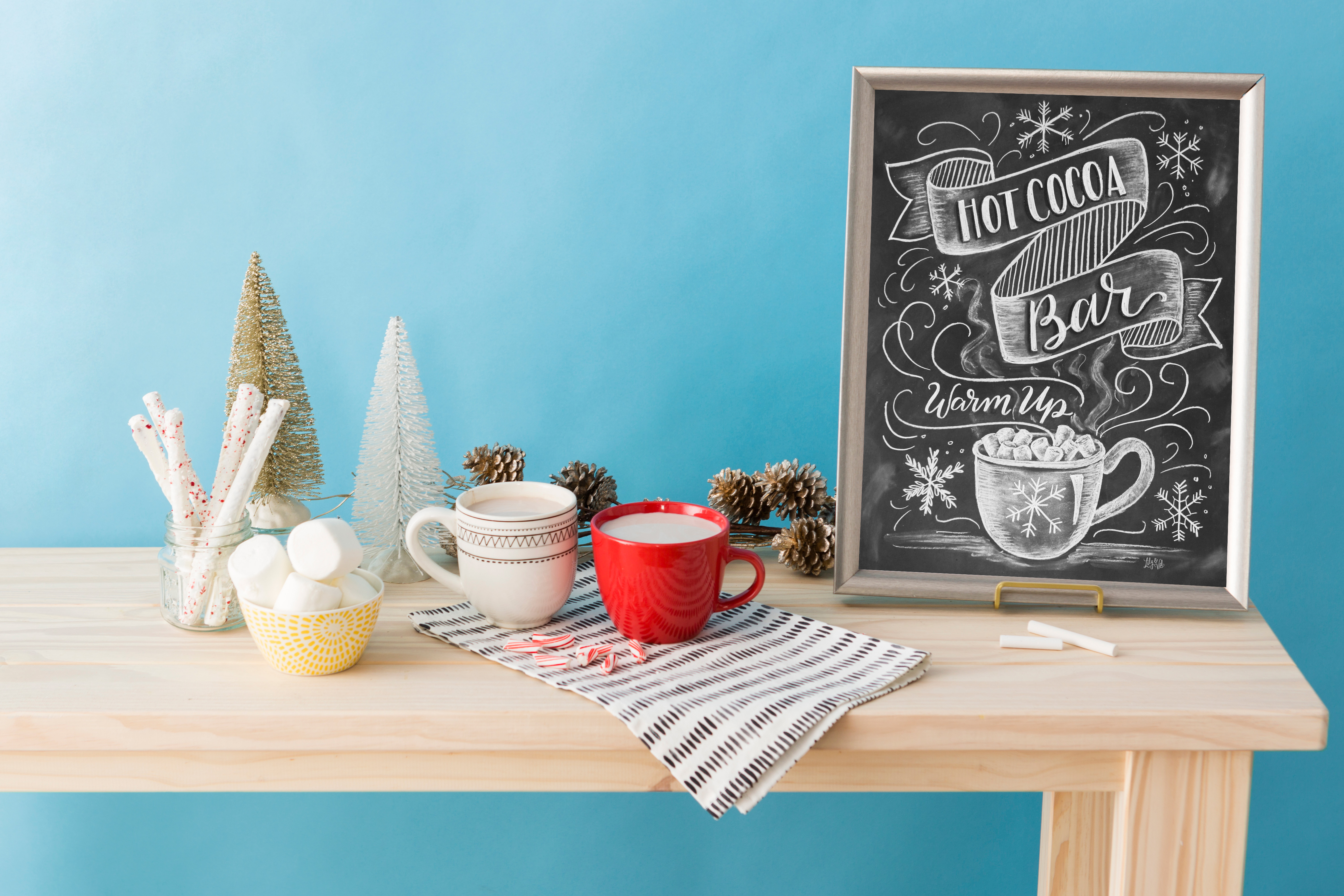 DIY Hot cocoa bar chalkboard sign by Valerie McKeehan offered as a free 17 page design guide through Brit + Co