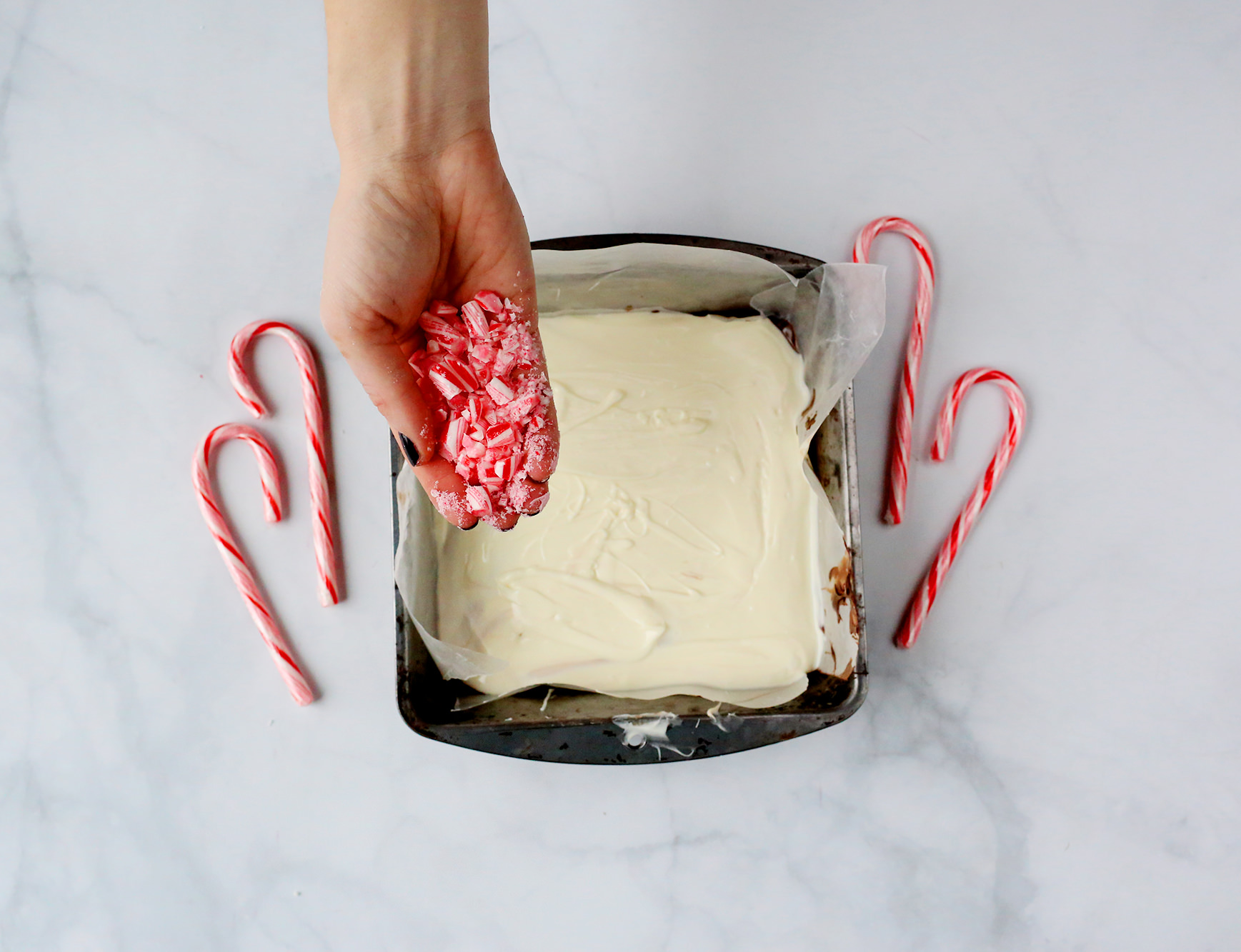 Crushed Peppermint over top of white chocolate makes for a perfect Christmas treat! Recipe via Lily & Val Living!