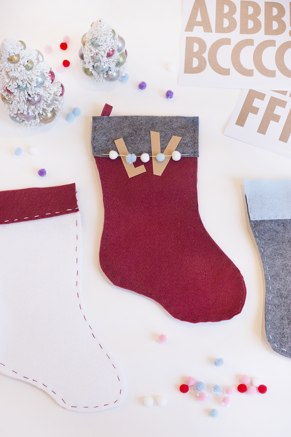 Need an easy holiday DIY? Try our hand-stitched felt stocking! It's cute, inexpensive, and only takes about an hour. Click through to read the steps and add some festive adorableness to your mantle!