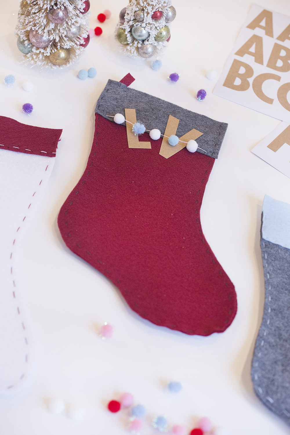 Need an easy holiday DIY? Try our hand-stitched felt stocking! It's cute, inexpensive, and only takes about an hour. Click through to read the steps and add some festive adorableness to your mantle!