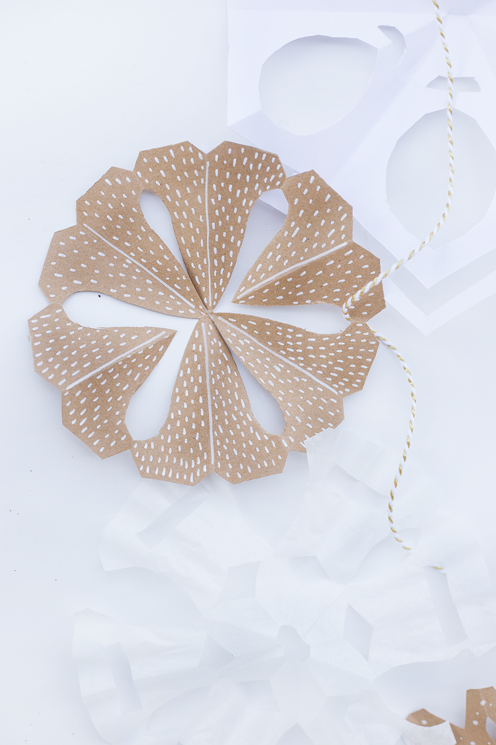 Make these modern paper snowflakes for your home this winter! Using different textures is a must for creating visual interest. Click through to read our easy DIY!