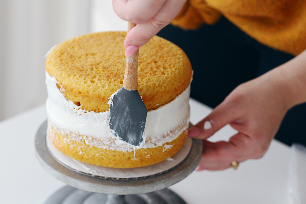 How to ice a two-tiered cake like a pro on the Lily & Val Blog