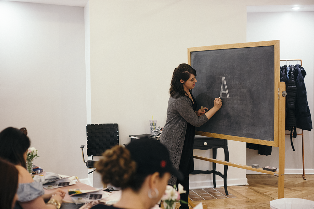 Valerie McKeehan, author of The Complete Book of Chalk Lettering, teaching a Chalk Lettering Techniques Workshop at the Lily & Val Flagship Store in Pittsburgh