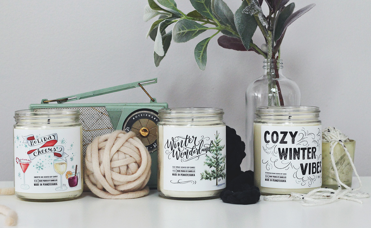 Unique holiday soy candles with labels hand-drawn by Lily & Val and hand-poured by Candelles