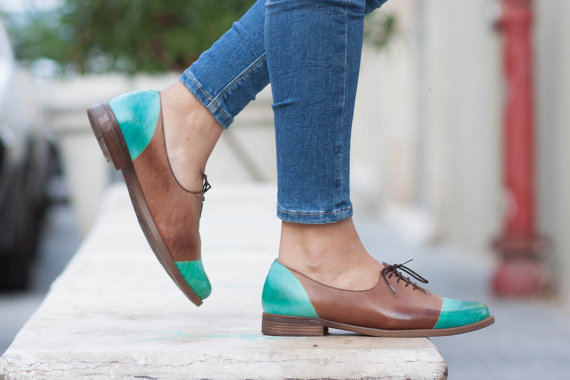 Jade green handmade leather shoes with camel color accents. 