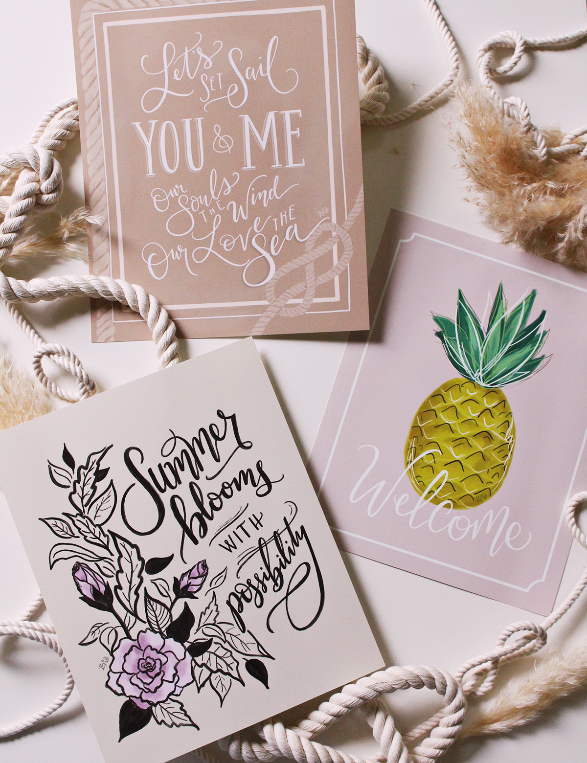 Welcome Summer with this bold hand-lettered collection of prints, canvas and pillows by Lily & Val