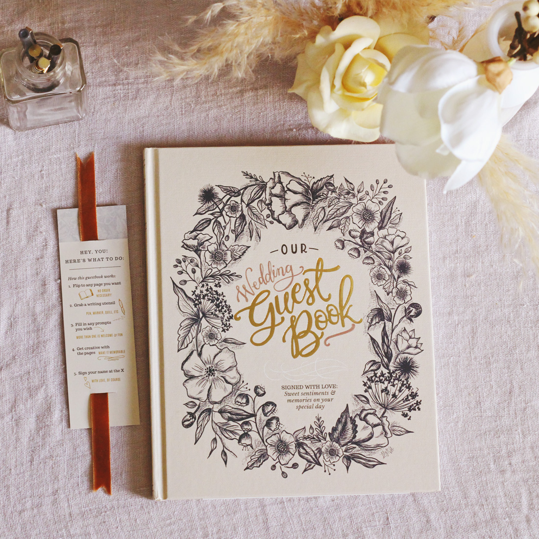 The Lily & Val Wedding Guestbook is an interactive, sentimental take on the traditional wedding guestbook featuring heartfelt prompts for your guests to fill out