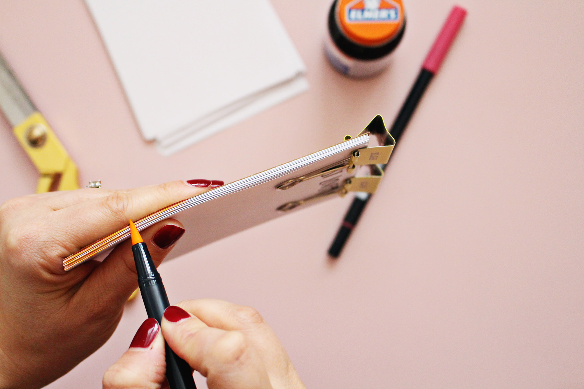 For an extra pop of color, use a marker to color the edges of the pages of your DIY notepad