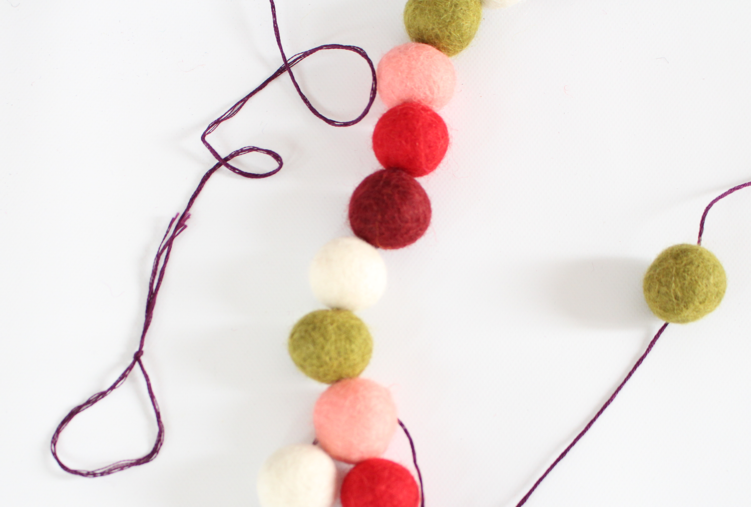 DIY felt ball garlands are easy to make for your holiday mantel decorating