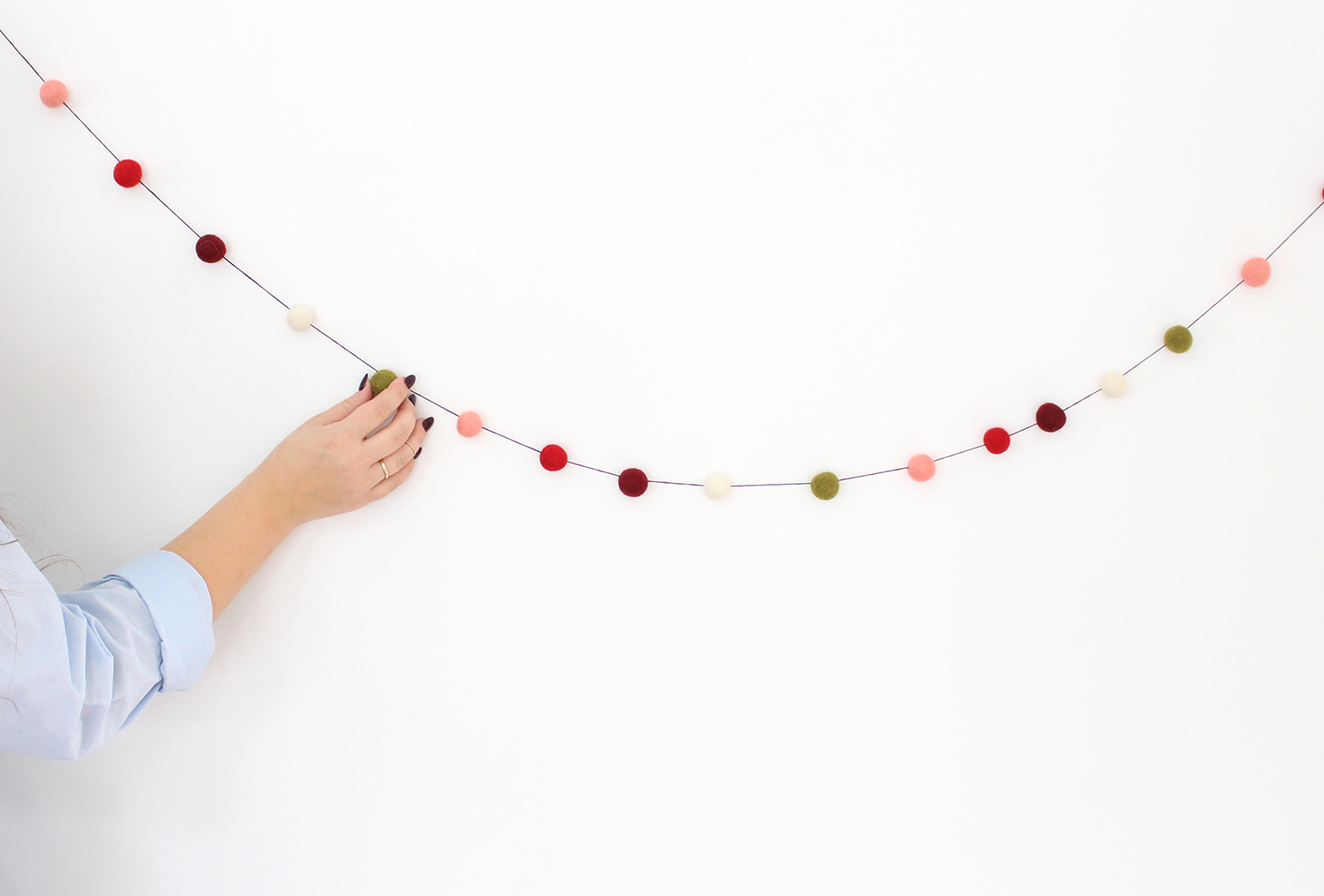 DIY felt ball garlands will make a big impact on your holiday decor this year